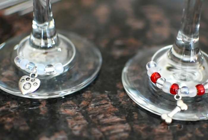 dog-themed charms on the bottoms of wine glasses