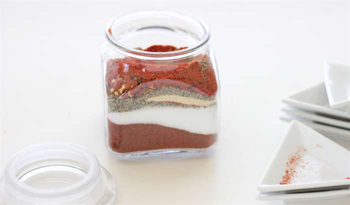 barbeque spices layered in a jar