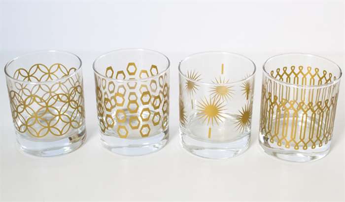 clear glasses with gold designs