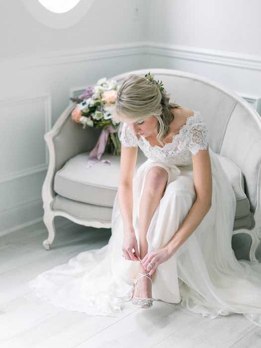 bride putting on her shoes