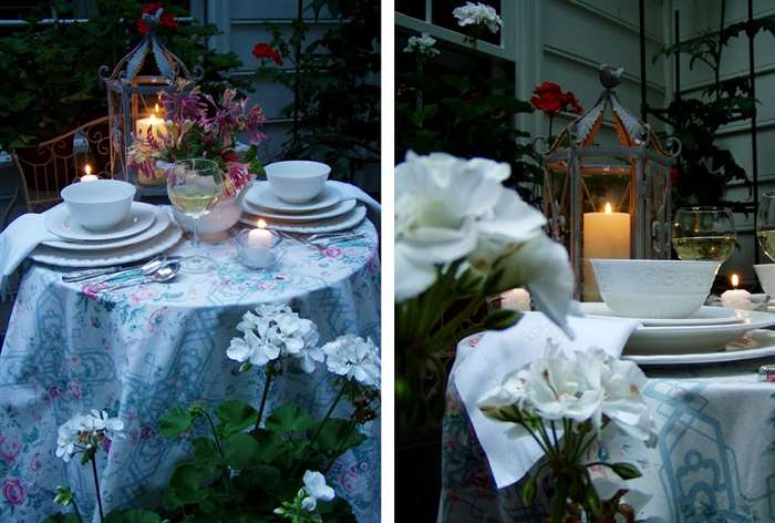 Vintage table with lantern and white dishes