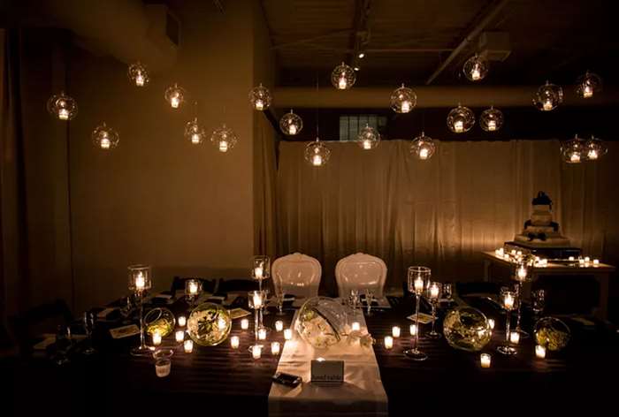 Black and white table with hanging candles 