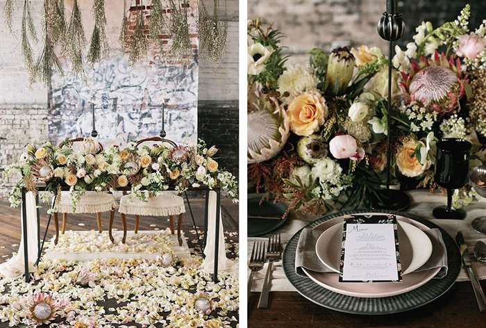 Table with big flower arrangements and petal accents