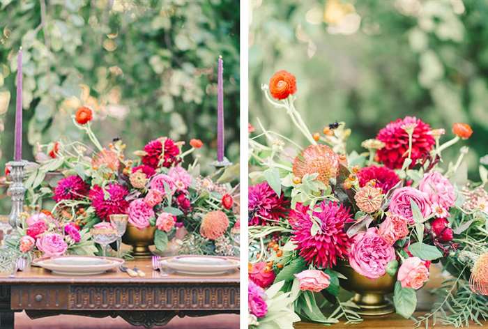 Table with bright flowers and purple candles 