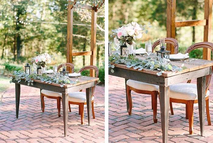 Simple wooden table with eucalyptus plants