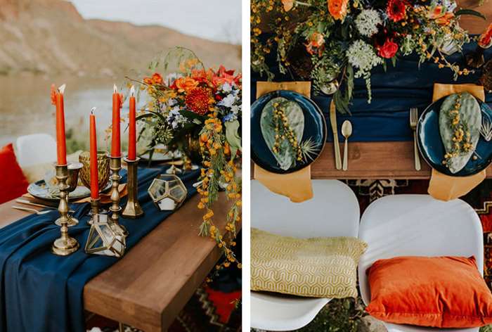 Dark blue table runner and plates with orange florals and candles