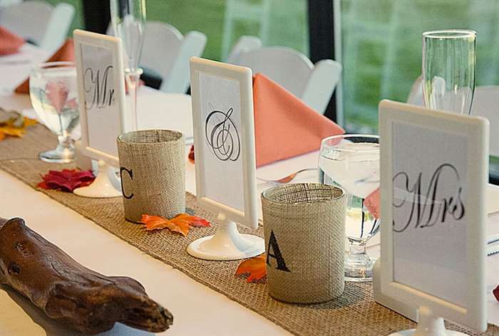 Table with fall leaves and driftwood and burlap accents 