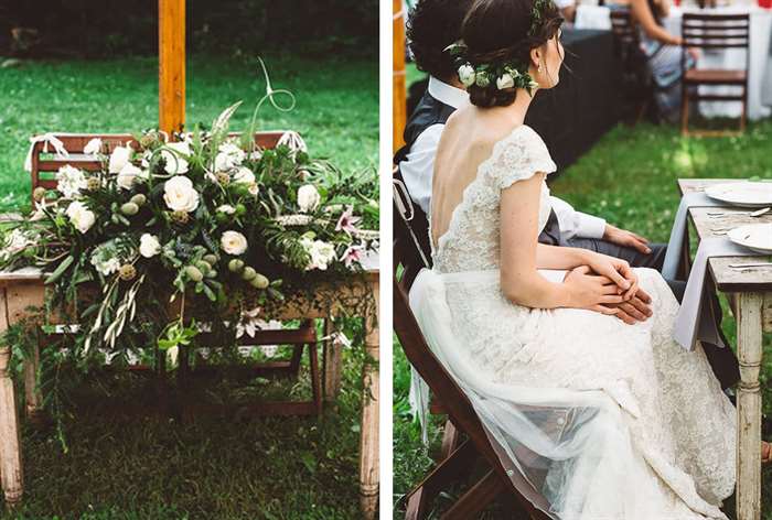 Simple wooden table with large green and white floral arrangement 