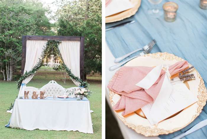 Chandelier hanging above table with gold china and lilac accents