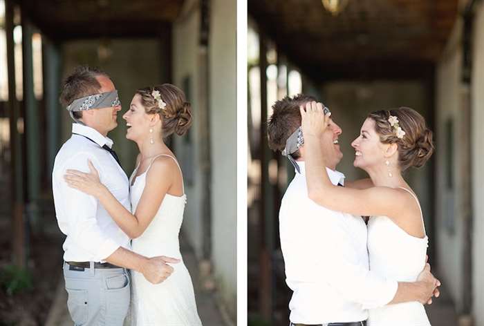 Bride lifting gray blindfold off of her groom