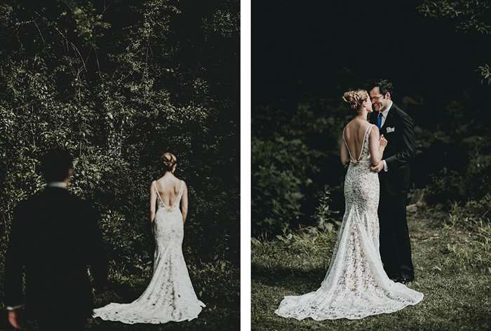 Groom walking up behind bride in the woods