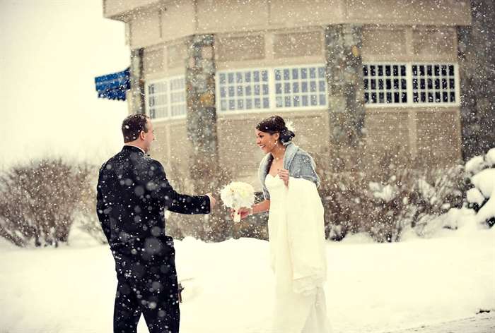 Bride and groom first look while it is snowing 