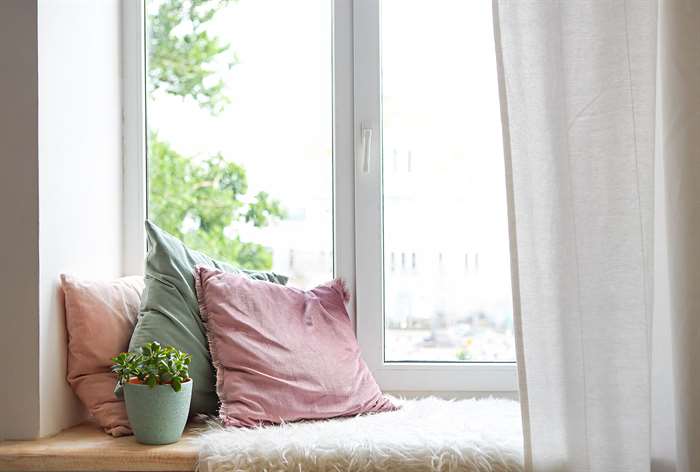 Window seat with pillows.