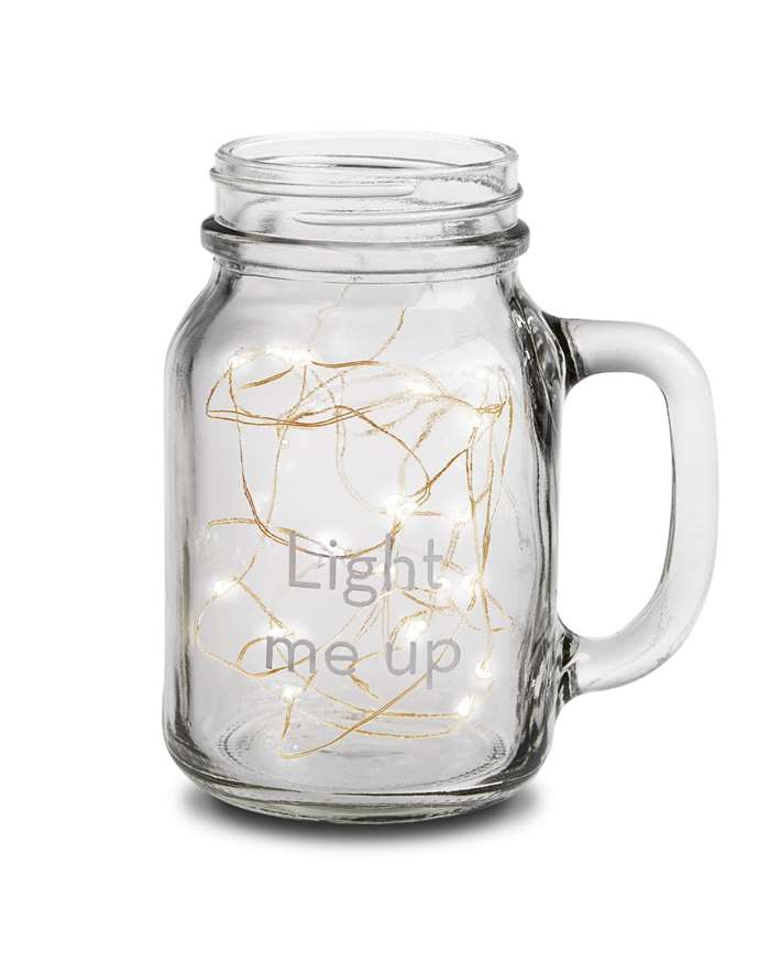 mason jar with string lights in the jar with the message light me up