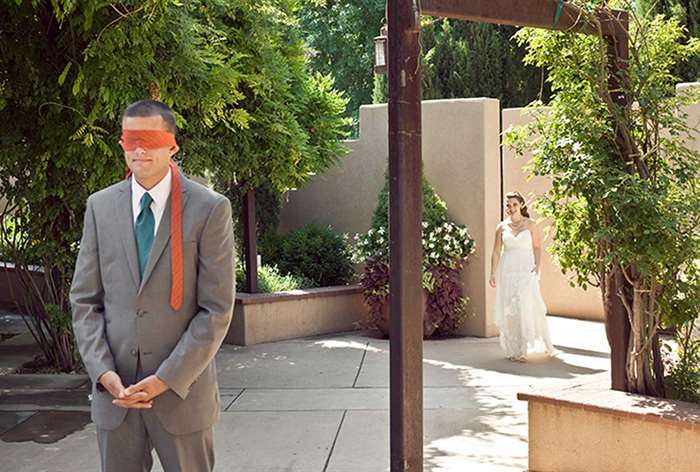 Groom with orange tie blindfold