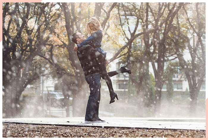 hug in snow christmas engagement photo