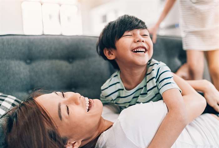 mother and son laughing