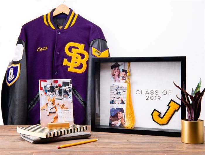 Letterman jacket and graduation shadow box