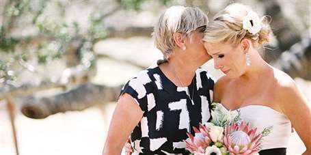 sweet moment between mother of the bride and her daughter at wedding
