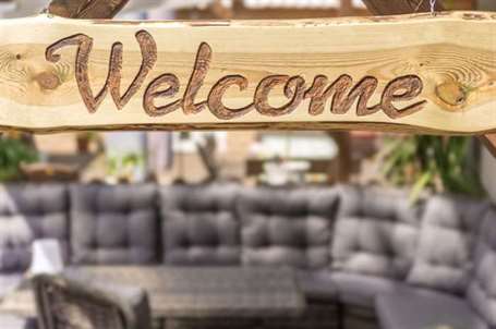 Etched in wood welcome sign