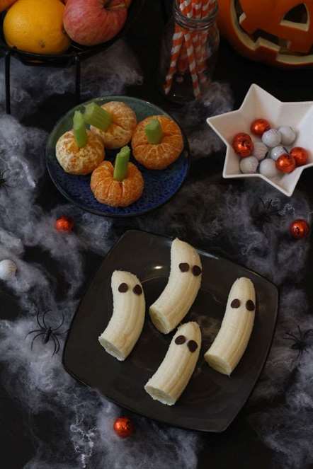 Halloween ý tưởng trái cây bí ngô clementine và boo nanas