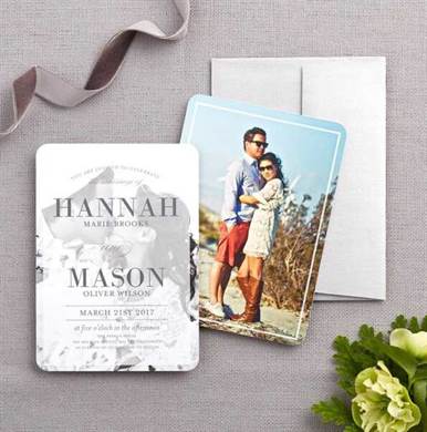 Personalized wedding invitation with a photo of a couple.